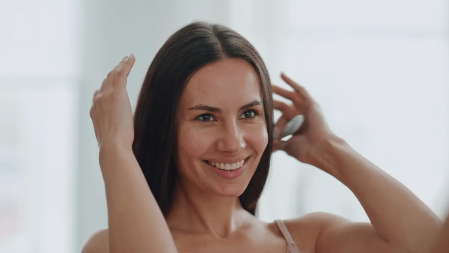 Woman smiling with healthy, radiant skin after Platelet-Rich Plasma Therapy facial.