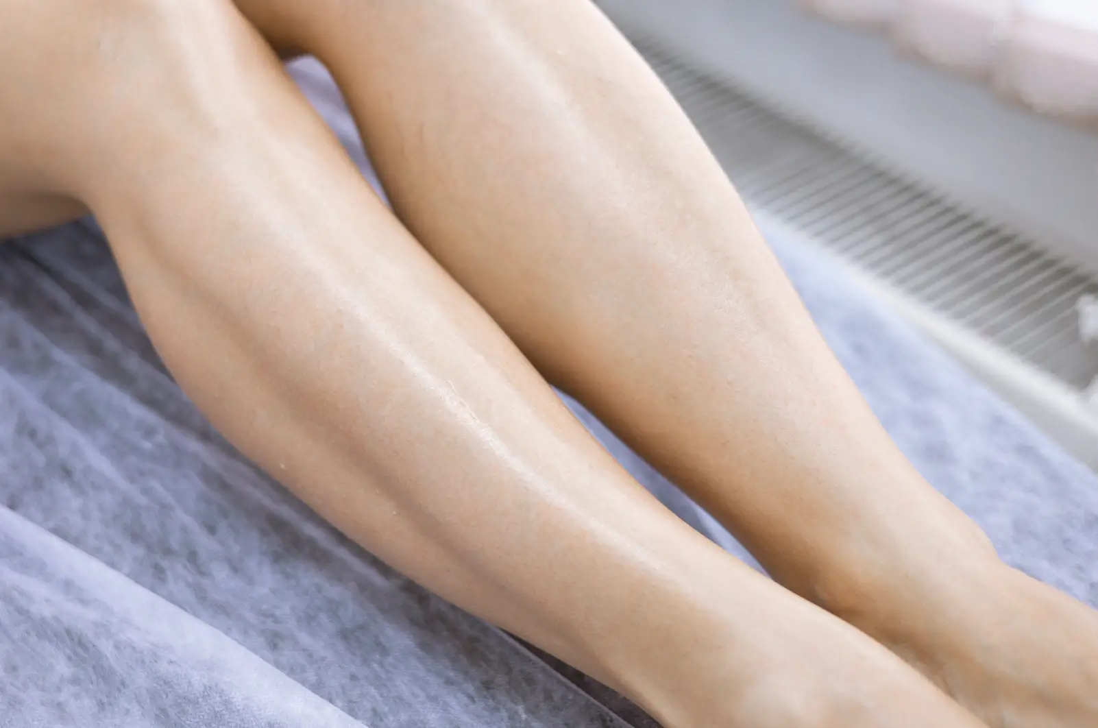 Legs with even skin tone and improved circulation after Sclerotherapy procedure.